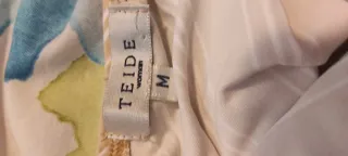 Top escote halter rayas beige y blanco