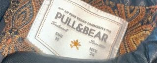 Cazadora estampada con cremalleras