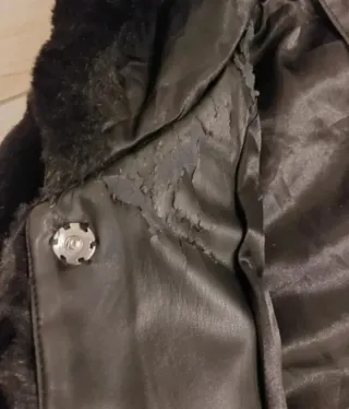 Pellicciotto ecologico nero con cappuccio Tg M