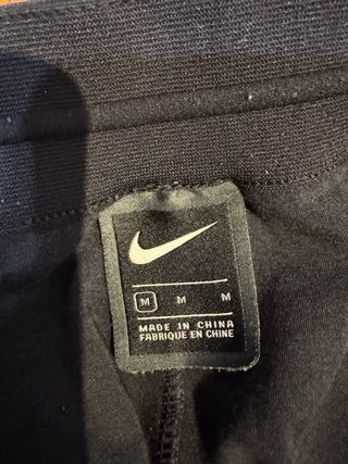 Pantalón Nike Azul con agujero en bolsillo