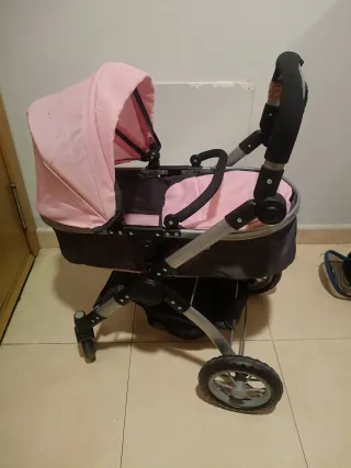 Carrito de muñecas rosa