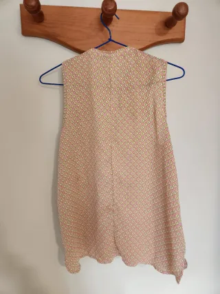 Blusa sin mangas con cremallera