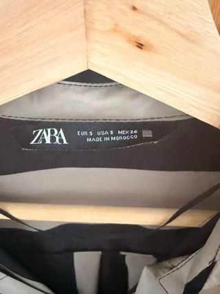 Camisa de rayas beige y negra