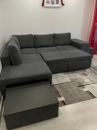 Sofá cama gris de tela