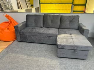 Sofá cama gris con arcón