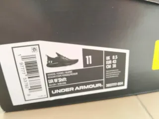 Deportivas running Under Armour grises