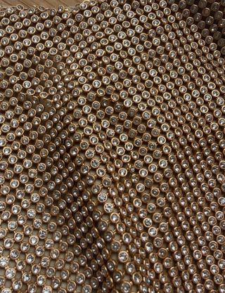 Bolso Zara dorado con cadena