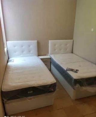 2 Camas individuales con cabecero blanco