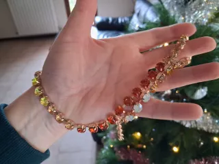 Collana dorata con cristalli sfumati arancio