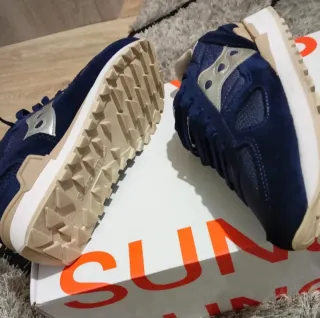 Zapatillas Saucony Azul y Dorado.