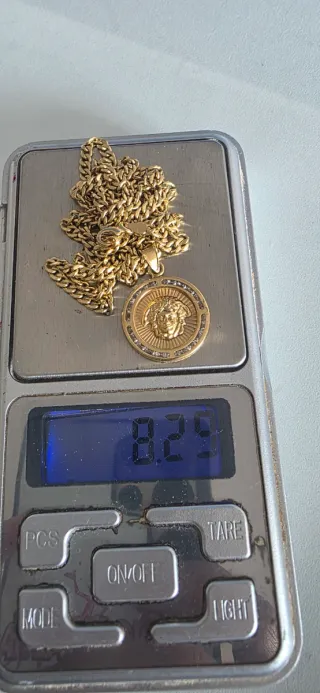 Cadena 18k 750 con dije Versace 750 negociable