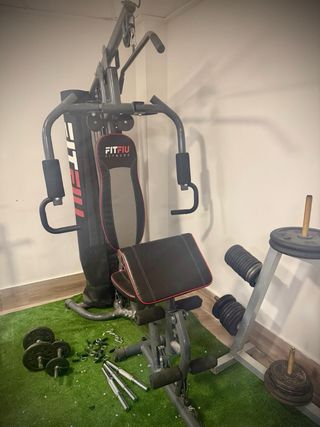 Banco de pesas con barra y discos