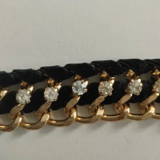 Cinturón fiesta cadena dorado, negro y strass.