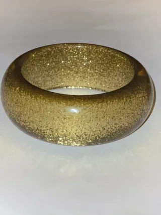 Pulsera rígida dorada con purpurina