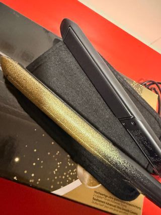 Plancha de pelo Remington negra y dorada