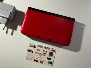Nintendo 3DS XL rosso con molti giochi