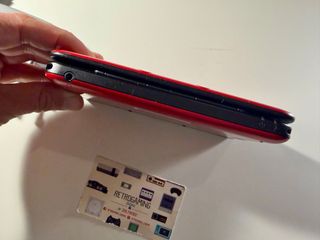 Nintendo 3DS XL rosso con molti giochi