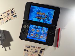 Nintendo 3DS XL rosso con molti giochi