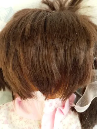 Muñeca con chupete y osito rosa