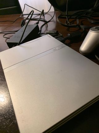 PlayStation 2 Slim plateada + 7 Juegos