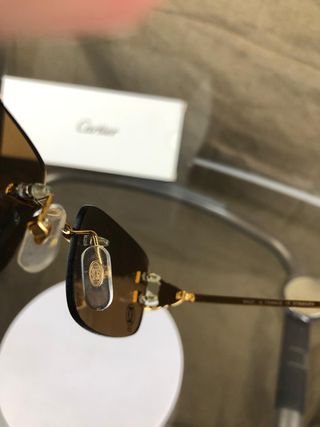 Occhiali da sole Cartier dorati marroni