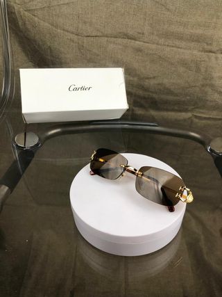 Occhiali da sole Cartier dorati marroni