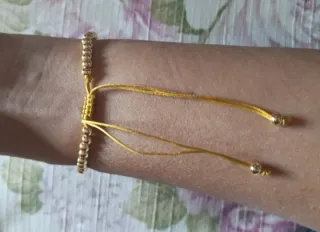 PULSERA MONEDA BOLAS BAÑO ORO 18KILATES HILO