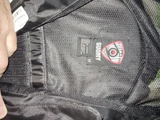 Mono de moto SUOMY verde y negro