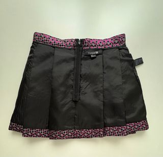 Minifalda plisada fucsia y negro