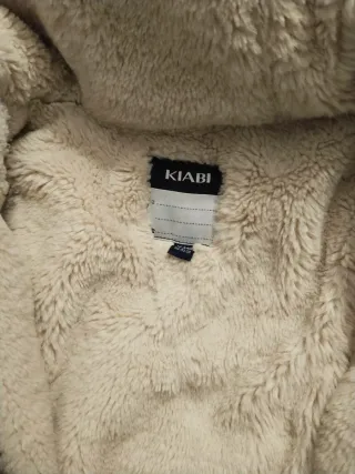 Cazadora verde con capucha y pelo