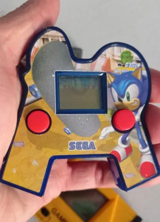 OCASION Lote consolas, muñeco y soporte