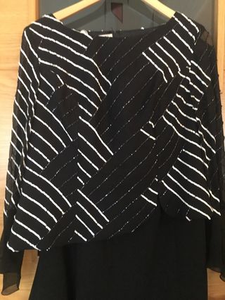 Elegante traje negro y plateado