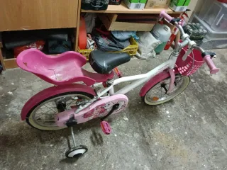 Bicicleta Btwin niña rosa con ruedines