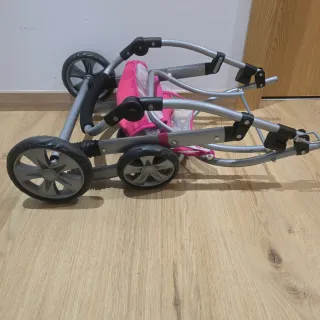 Silla de paseo para muñecas rosa