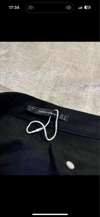 Falda ante negra botones mini falda