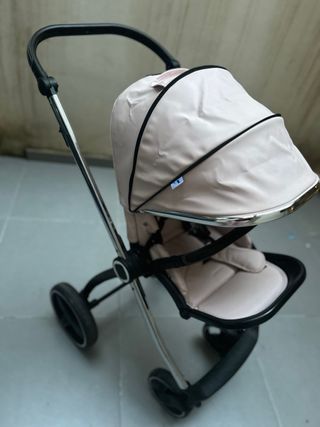 Carro de bebé rosa y cromado