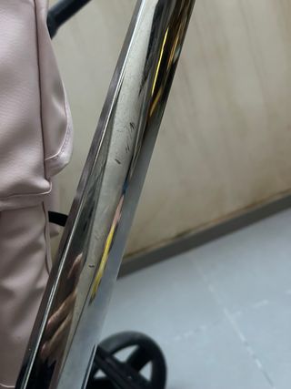 Carro de bebé rosa y cromado