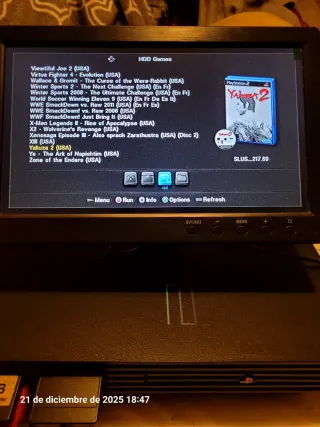 PS2 con pantalla, mando y juegos