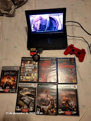 PS2 con pantalla, mando y juegos