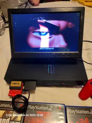 PS2 con pantalla, mando y juegos