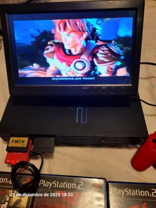 PS2 con pantalla, mando y juegos