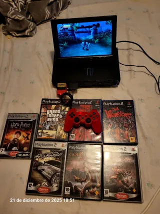 PS2 con pantalla, mando y juegos