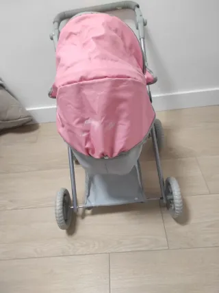 Carrito de muñecas rosa