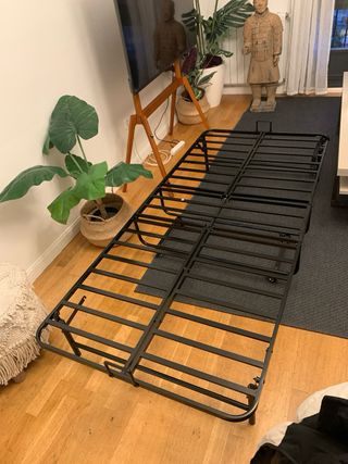 Cama supletoria plegable negra y beige