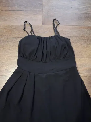 Mono negro elegante pantalón ancho