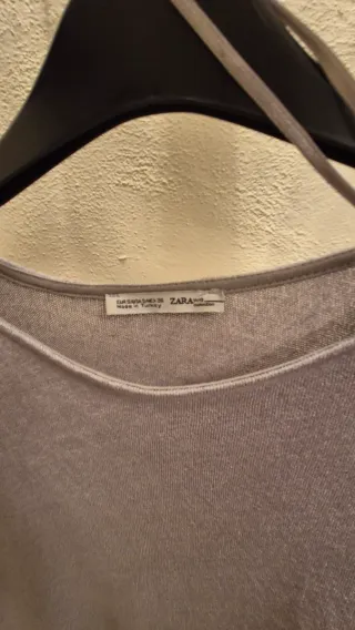 Blusa grigio e bianco