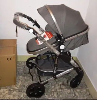 Carrito de bebé y silla de coche gris