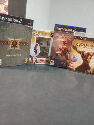 Lote God of War PS2, PS3 y Figura Funko Pop