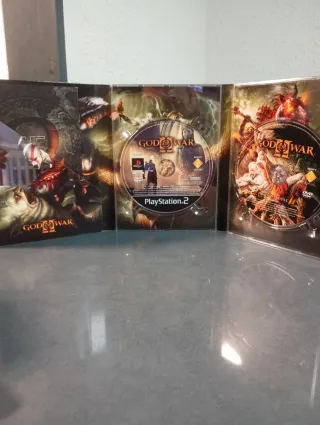 Lote God of War PS2, PS3 y Figura Funko Pop