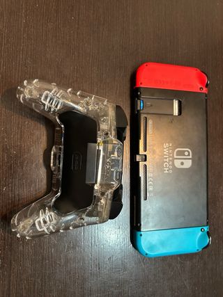 Nintendo Switch + Mando Pro Transparente + 2 Juego